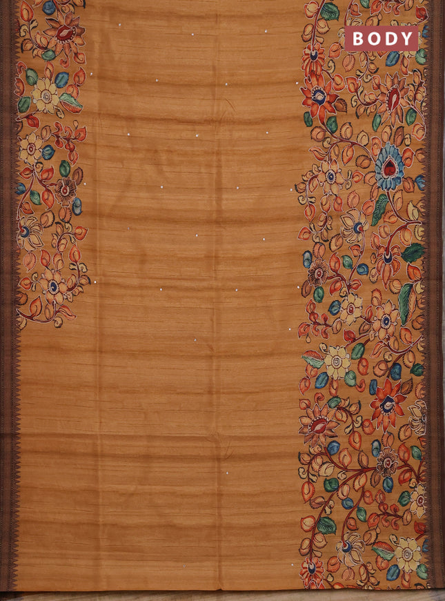 Semi raw silk saree rustic orange shade and coffee brown with mirror embroidery buttas and long kalamkari printed embroidery border