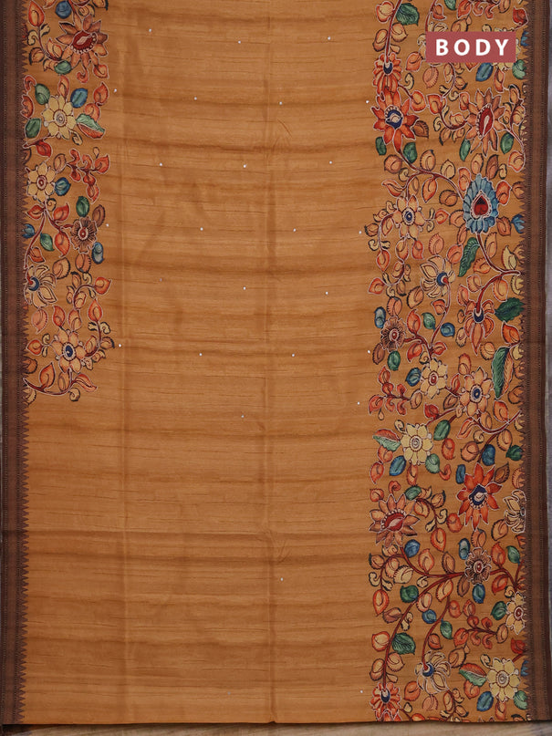 Semi raw silk saree rustic orange shade and coffee brown with mirror embroidery buttas and long kalamkari printed embroidery border