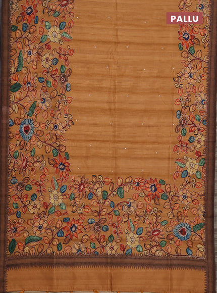 Semi raw silk saree rustic orange shade and coffee brown with mirror embroidery buttas and long kalamkari printed embroidery border