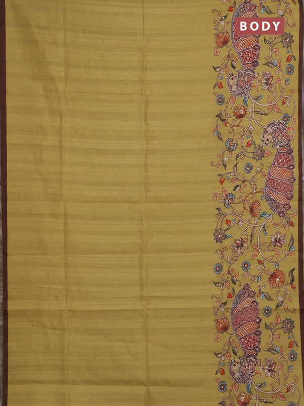 Semi raw silk saree mustard yellow and coffee brown with plain body and long kalamkari printed embroidery border