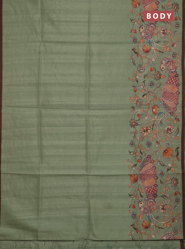 Semi raw silk saree pastel green and coffee brown with plain body and long kalamkari printed embroidery border