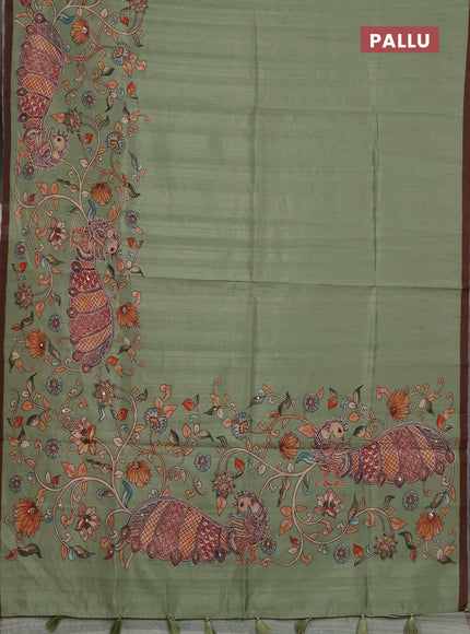 Semi raw silk saree pastel green and coffee brown with plain body and long kalamkari printed embroidery border