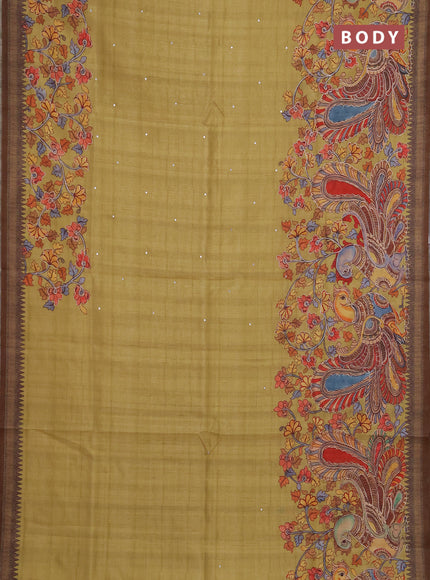 Semi raw silk saree mustard yellow and coffee brown with mirror embroidery buttas and long kalamkari printed embroidery border