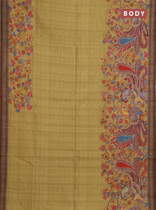 Semi raw silk saree mustard yellow and coffee brown with mirror embroidery buttas and long kalamkari printed embroidery border