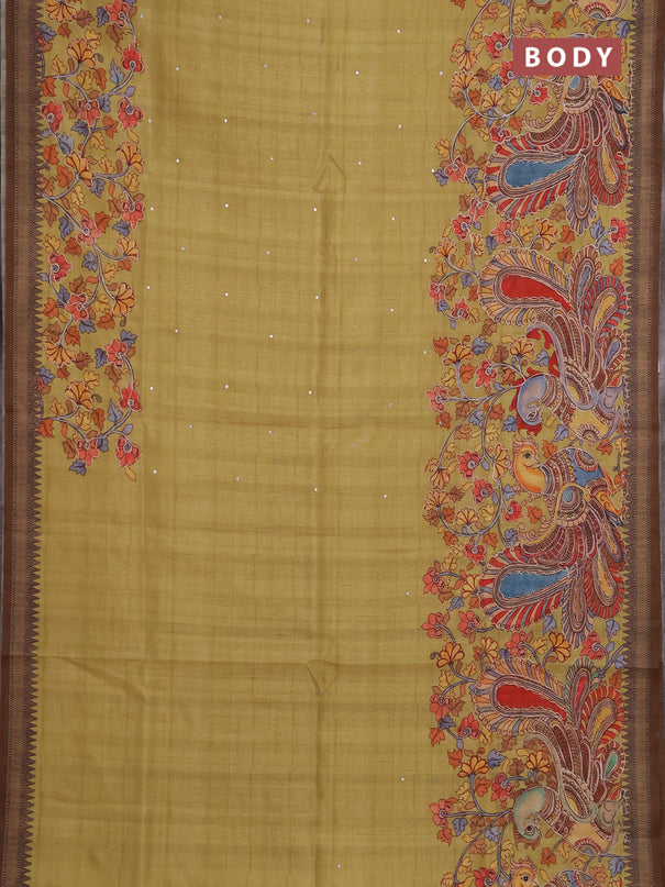 Semi raw silk saree mustard yellow and coffee brown with mirror embroidery buttas and long kalamkari printed embroidery border