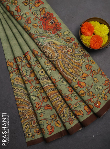Semi raw silk saree pastel green and coffee brown with plain body and long kalamkari printed embroidery border