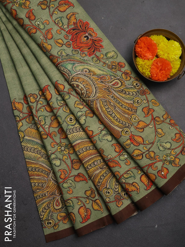 Semi raw silk saree pastel green and coffee brown with plain body and long kalamkari printed embroidery border