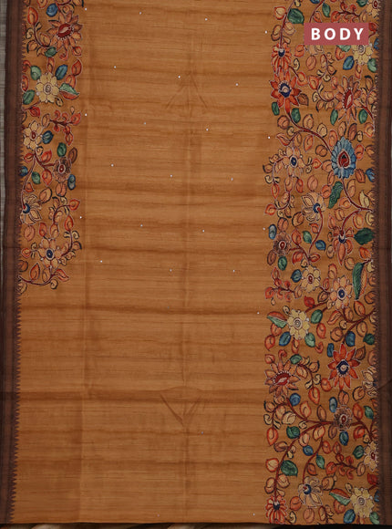 Semi raw silk saree rustic orange shade and coffee brown with mirror embroidery buttas and long kalamkari printed embroidery border