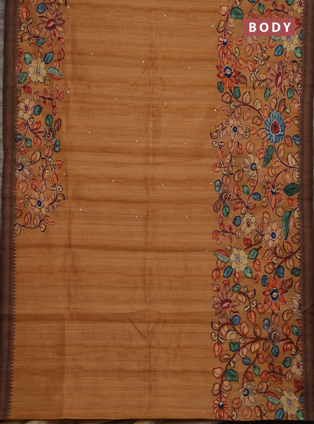 Semi raw silk saree rustic orange shade and coffee brown with mirror embroidery buttas and long kalamkari printed embroidery border