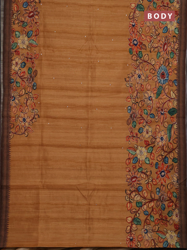 Semi raw silk saree rustic orange shade and coffee brown with mirror embroidery buttas and long kalamkari printed embroidery border