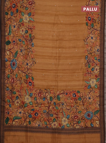 Semi raw silk saree rustic orange shade and coffee brown with mirror embroidery buttas and long kalamkari printed embroidery border