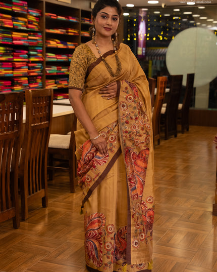 Semi raw silk saree mustard yellow and coffee brown with plain body and long kalamkari printed embroidery border