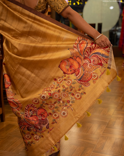 Semi raw silk saree mustard yellow and coffee brown with plain body and long kalamkari printed embroidery border
