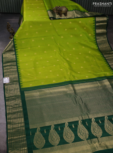 Pure gadwal silk saree light green and bottle green with zari woven buttas and temple design zari woven border