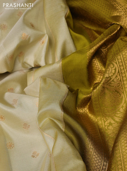 Pure gadwal silk saree cream and mehendi green with allover zari woven buttas and temple design zari woven border