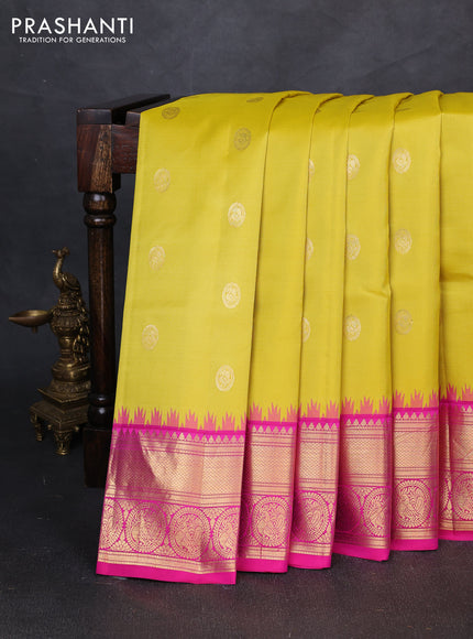 Pure gadwal silk saree lime yellow and pink with allover zari woven buttas and temple design zari woven border