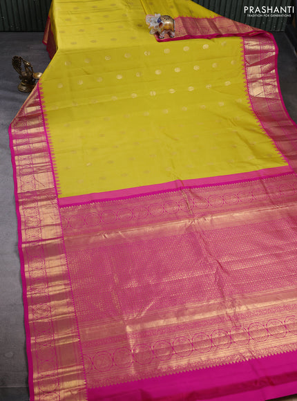 Pure gadwal silk saree lime yellow and pink with allover zari woven buttas and temple design zari woven border