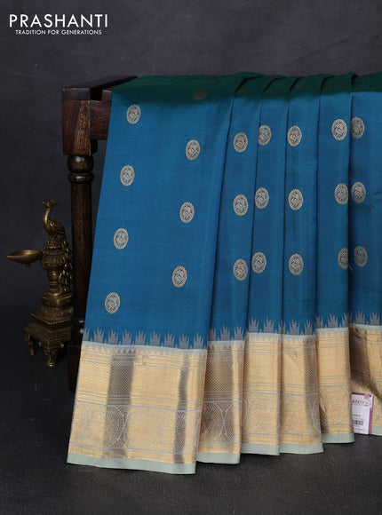 Pure gadwal silk saree dual shade of green and pastel green with allover zari woven buttas and temple design zari woven border