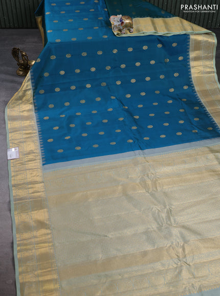 Pure gadwal silk saree dual shade of green and pastel green with allover zari woven buttas and temple design zari woven border