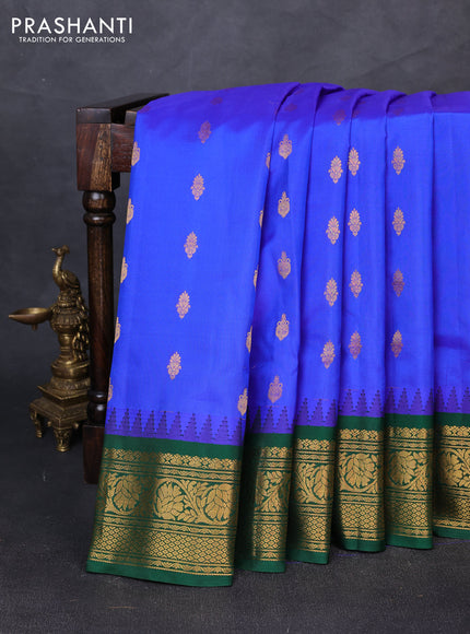 Pure gadwal silk saree royal blue and bottle green with allover zari woven buttas and temple design zari woven border