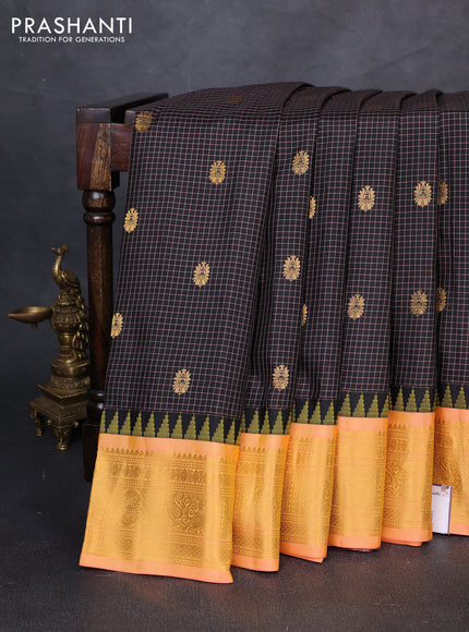 Pure gadwal silk saree black and peach orange with allover checks & zari woven buttas and temple design zari woven border