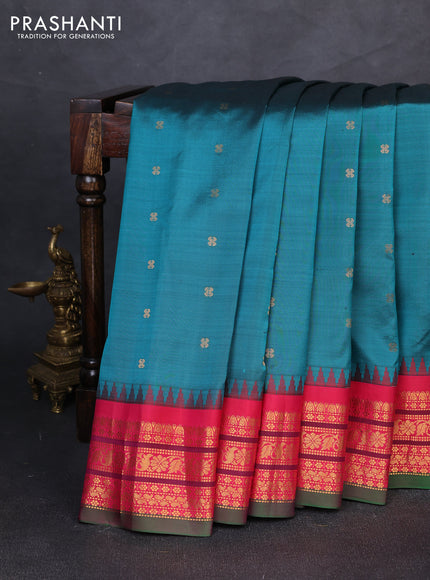 Pure gadwal silk saree peacock green and tomato pink with allover zari woven buttas and temple design zari woven border