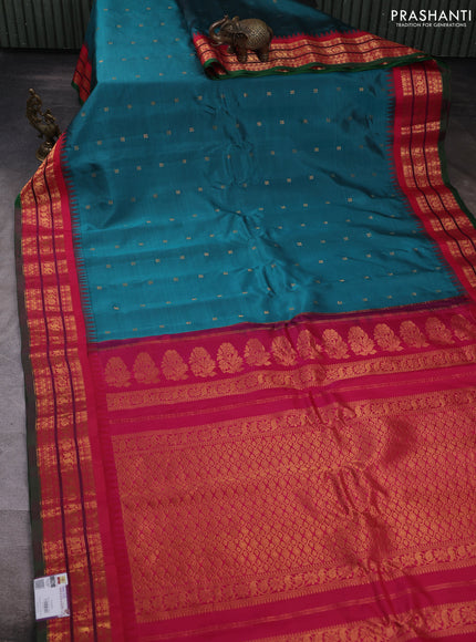 Pure gadwal silk saree peacock green and tomato pink with allover zari woven buttas and temple design zari woven border