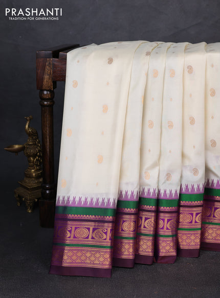 Pure gadwal silk saree off white and purple with allover zari woven buttas and temple design zari woven border