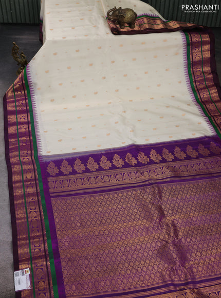 Pure gadwal silk saree off white and purple with allover zari woven buttas and temple design zari woven border