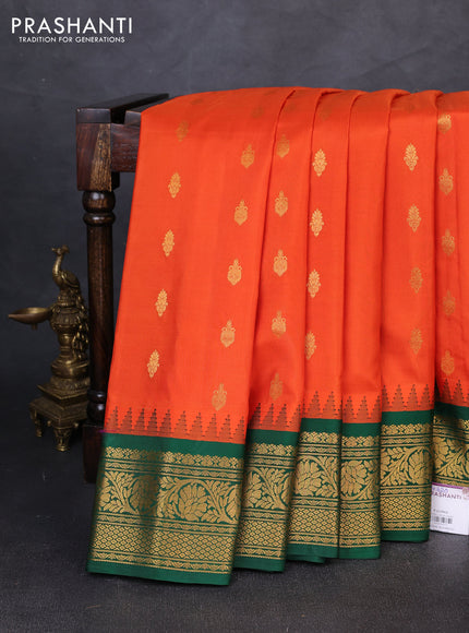 Pure gadwal silk saree orange and green with allover zari woven buttas and temple design zari woven border