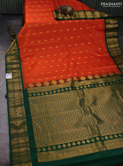 Pure gadwal silk saree orange and green with allover zari woven buttas and temple design zari woven border