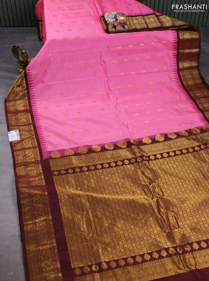 Pure gadwal silk saree pink and coffee brown with allover zari woven buttas and temple design zari woven border