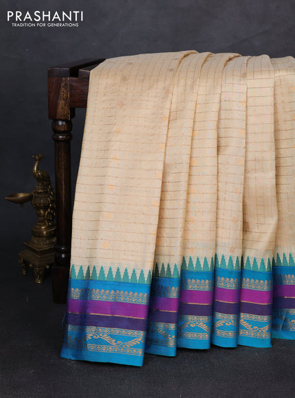 Pure gadwal silk saree cream and teal blue with allover zari checks & buttas and temple design zari woven border