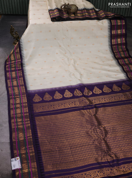 Pure gadwal silk saree cream and navy blue with allover zari woven buttas and temple design zari woven border