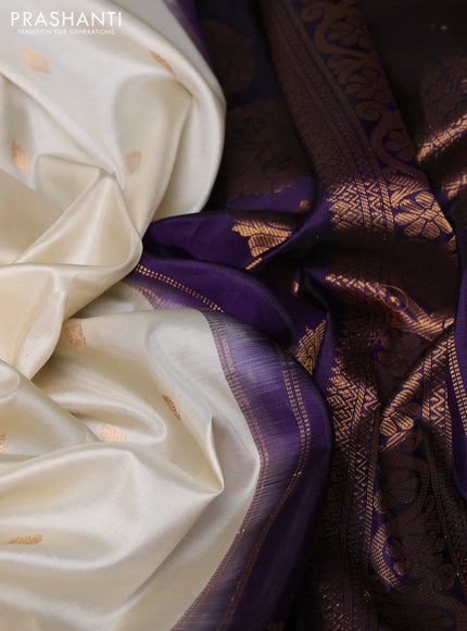 Pure gadwal silk saree cream and navy blue with allover zari woven buttas and temple design zari woven border