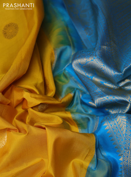 Pure gadwal silk saree yellow and cs blue with allover zari woven buttas and temple design zari woven border
