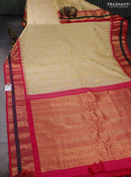 Pure gadwal silk saree cream and pink with allover zari woven buttas and temple design zari woven border