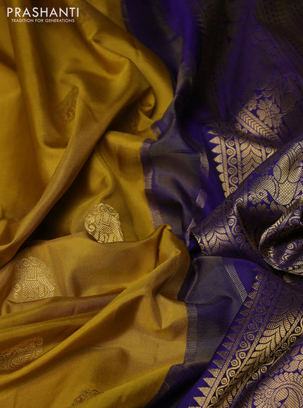 Pure gadwal silk saree mustard yellow and blue with allover zari woven buttas and temple design zari woven border