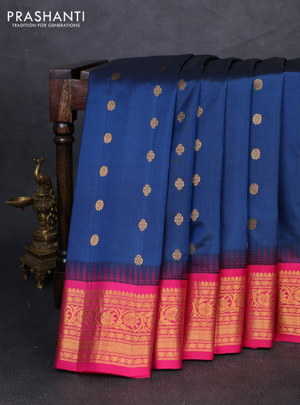 Pure gadwal silk saree peacock blue and pink with allover zari woven buttas and temple design zari woven border