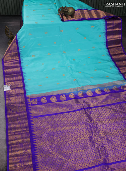 Pure gadwal silk saree teal blue and royal blue with allover zari woven buttas and temple design zari woven border