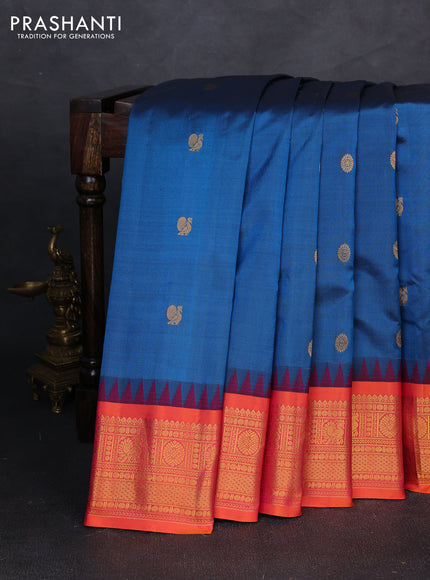 Pure gadwal silk saree peacock blue and orange with allover zari woven buttas and temple design zari woven border