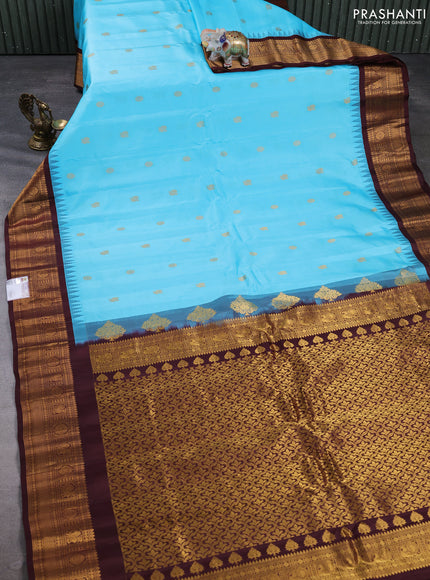 Pure gadwal silk saree teal blue and coffee brown with allover zari woven buttas and temple design zari woven border