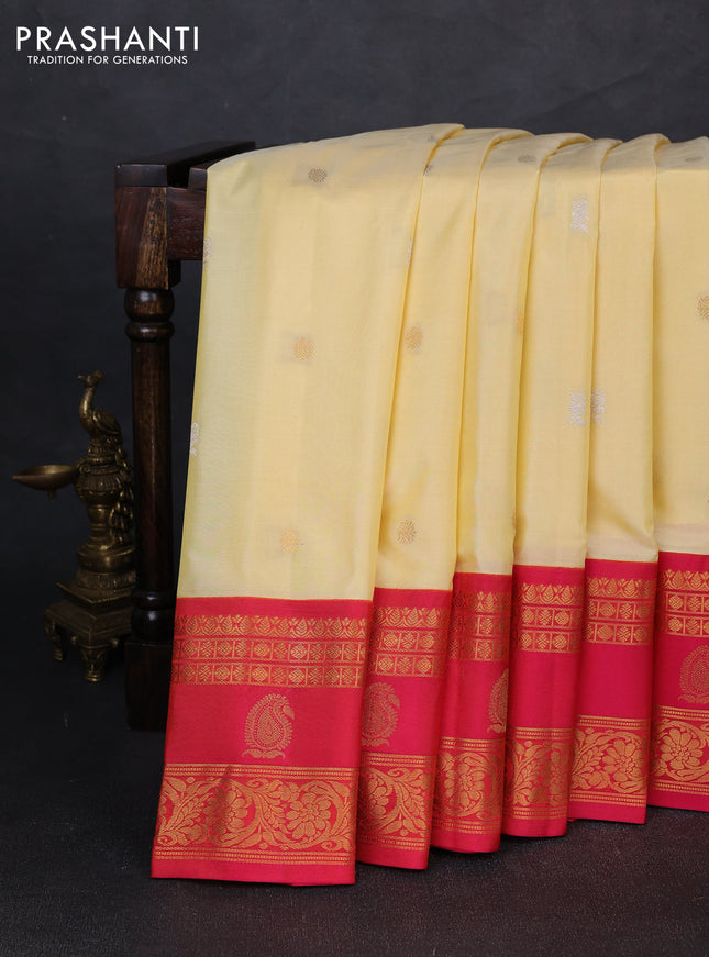 Pure gadwal silk saree pale yellow and pink with allover zari woven buttas and rettapet zari woven korvai border