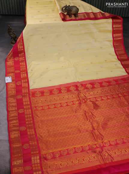 Pure gadwal silk saree pale yellow and pink with allover zari woven buttas and rettapet zari woven korvai border