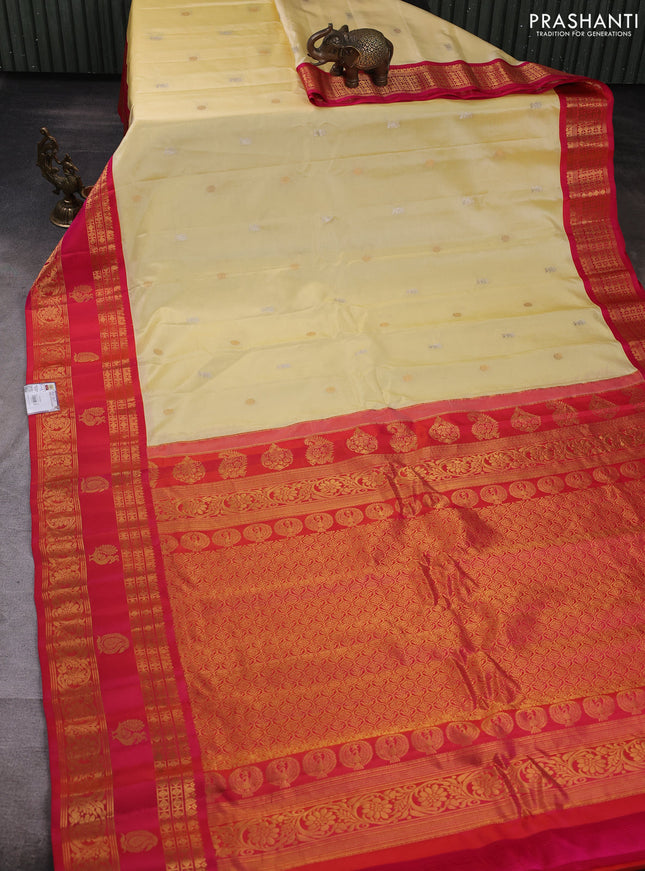 Pure gadwal silk saree pale yellow and pink with allover zari woven buttas and rettapet zari woven korvai border