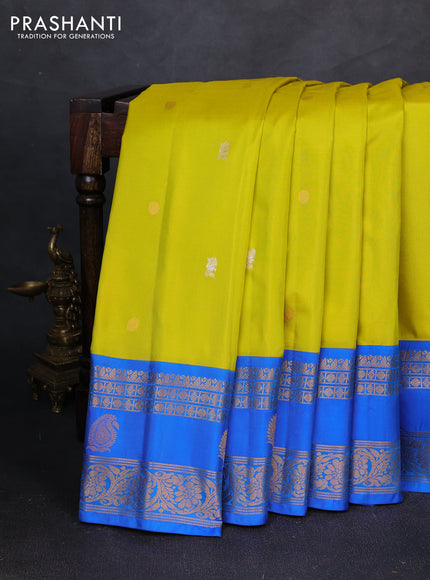Pure gadwal silk saree lime green and cs blue with allover zari woven buttas and zari woven korvai border