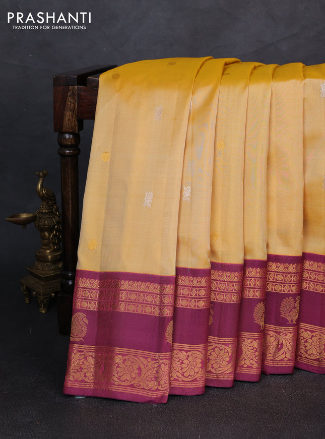 Pure gadwal silk saree pale yellow and magenta pink with allover zari woven buttas and rettapet zari woven korvai border