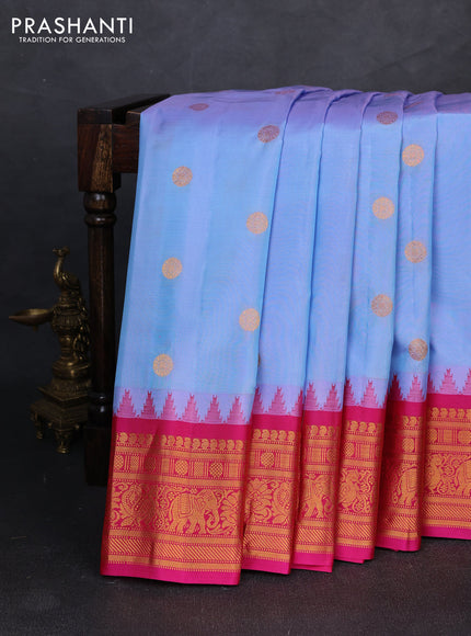 Pure gadwal silk saree pastel blue and pink with allover zari woven buttas and temple design zari woven border