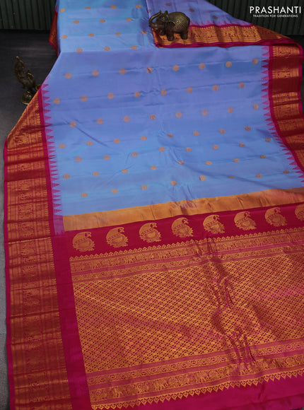 Pure gadwal silk saree pastel blue and pink with allover zari woven buttas and temple design zari woven border