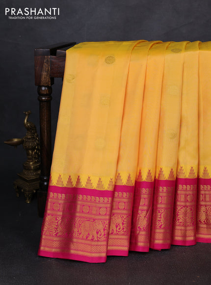 Pure gadwal silk saree yellow and pink with allover zari woven buttas and temple design zari woven border